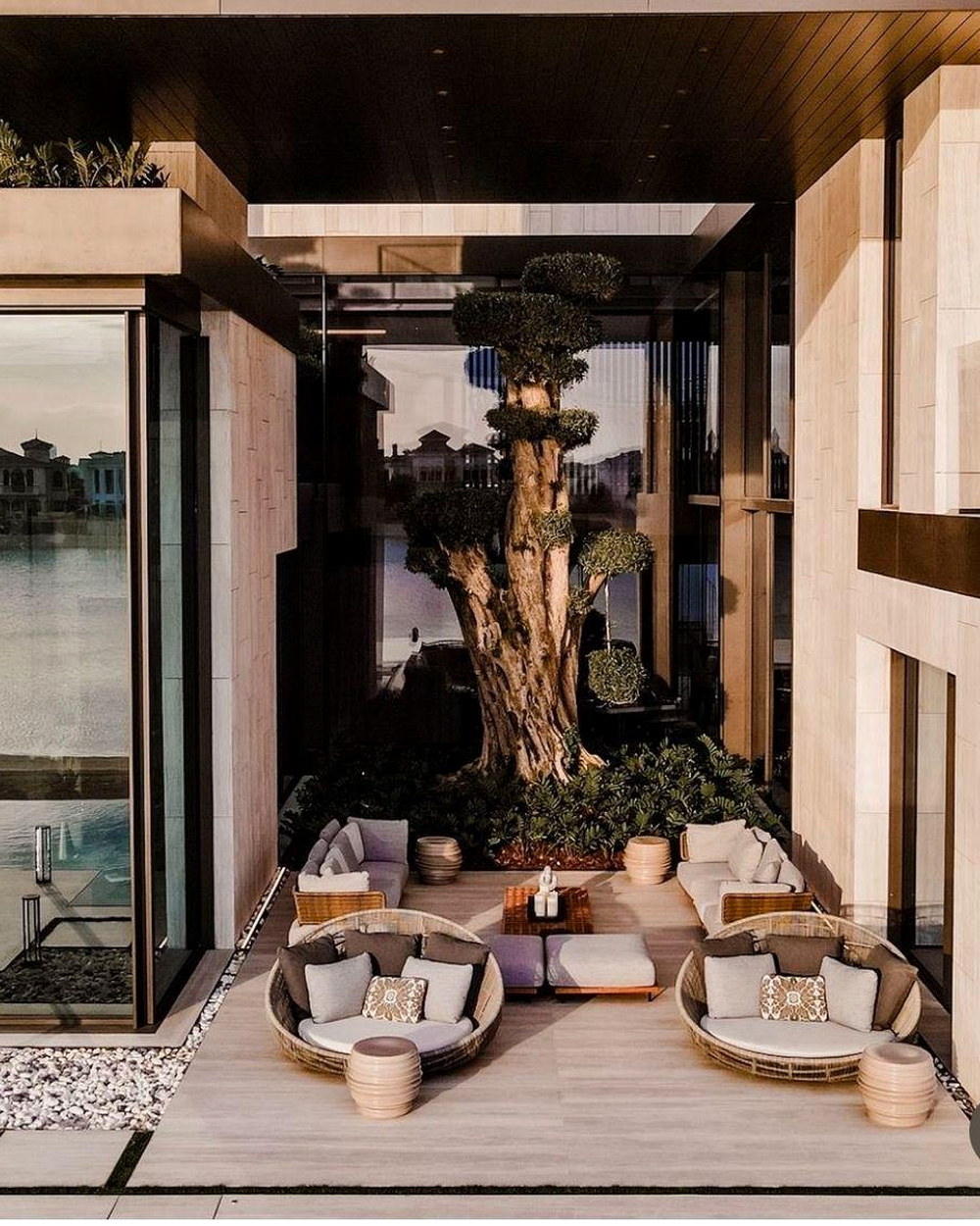 Luxury courtyard featuring natural stone architecture and landscaping